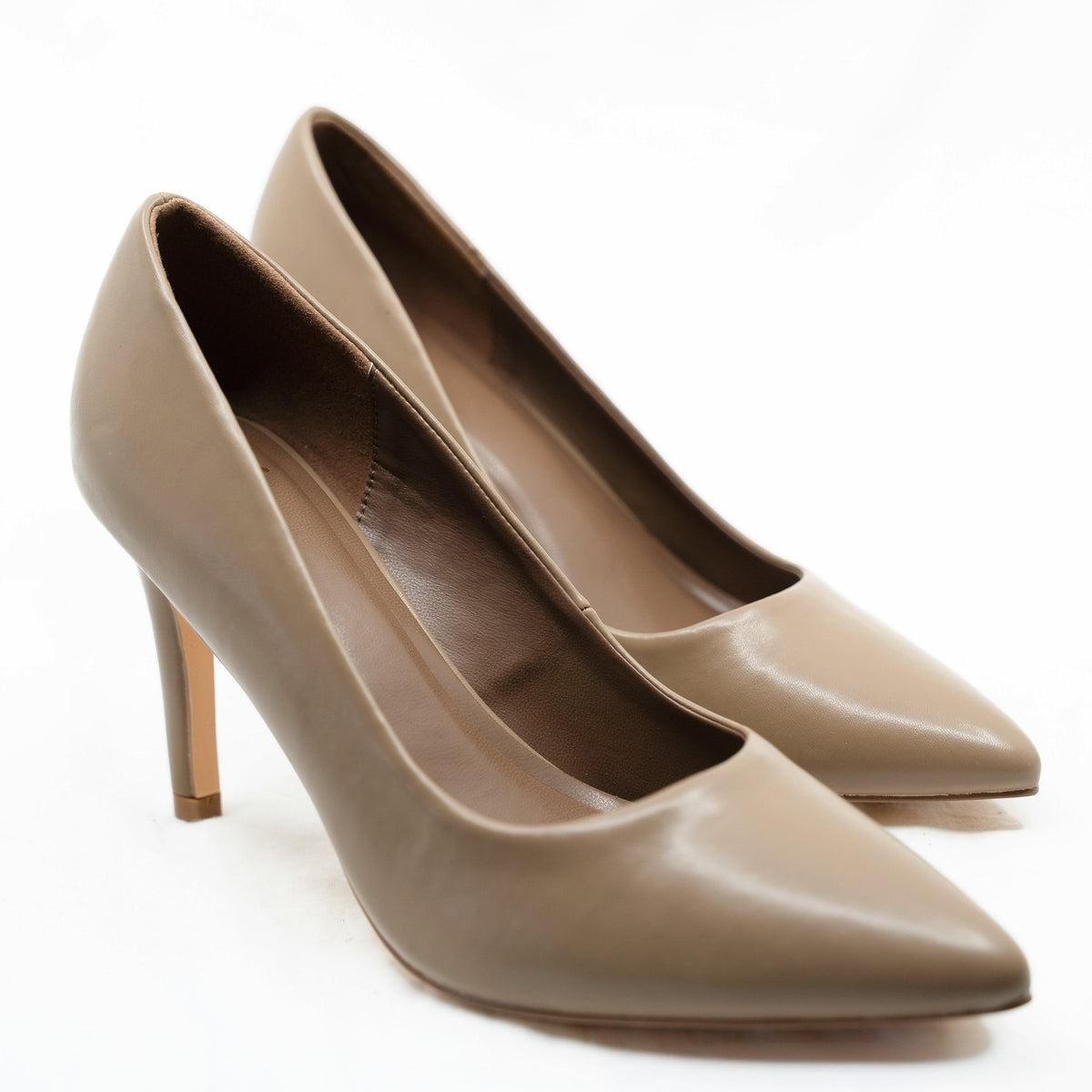 Close-up of a pair of Rebecca Allen The Point pointed-toe pumps in Nude II, a warm taupe, shown from the front three-quarter angle