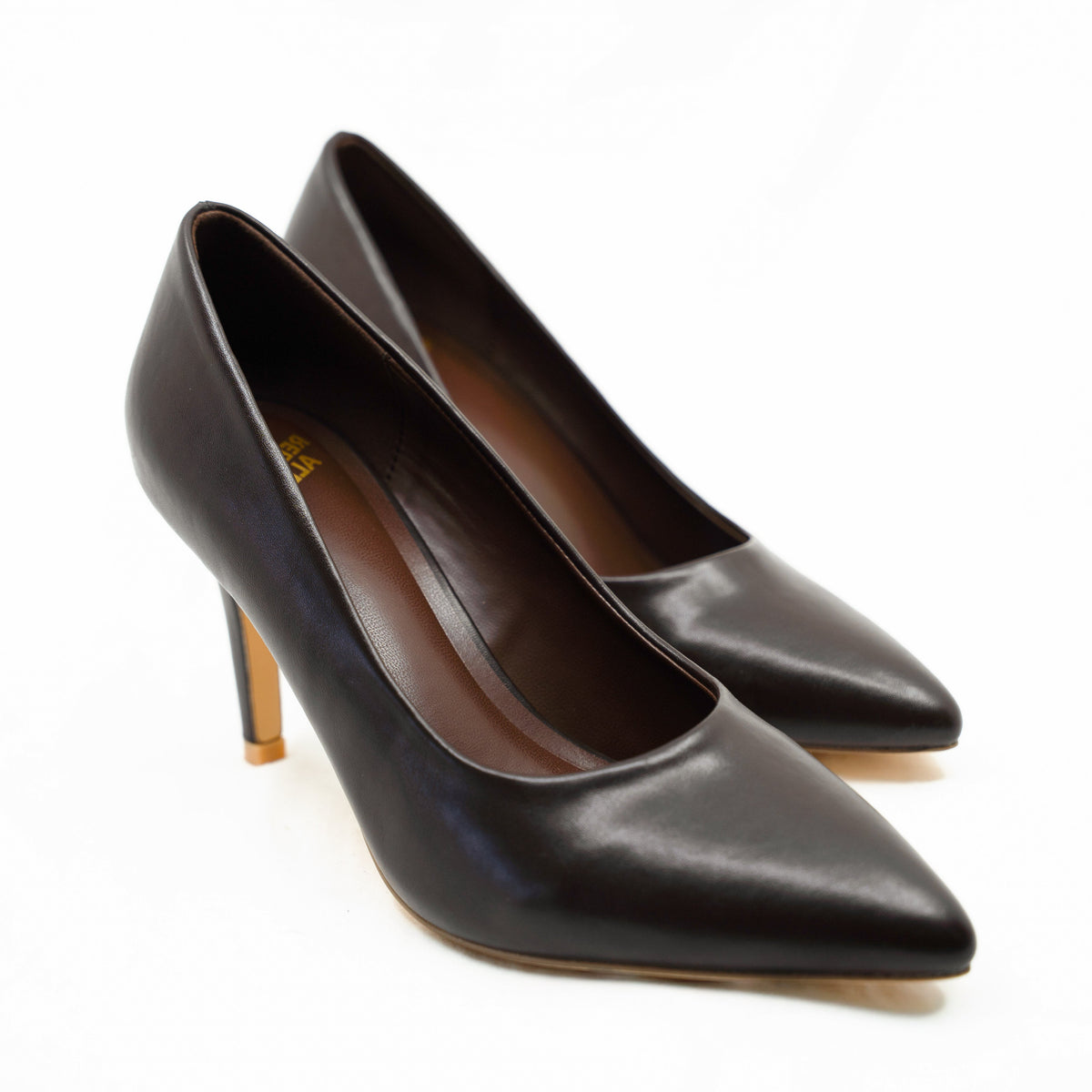 Close-up of a pair of Rebecca Allen The Point pointed-toe pumps in Nude I, a dark chocolate brown, shown from the front three-quarter angle